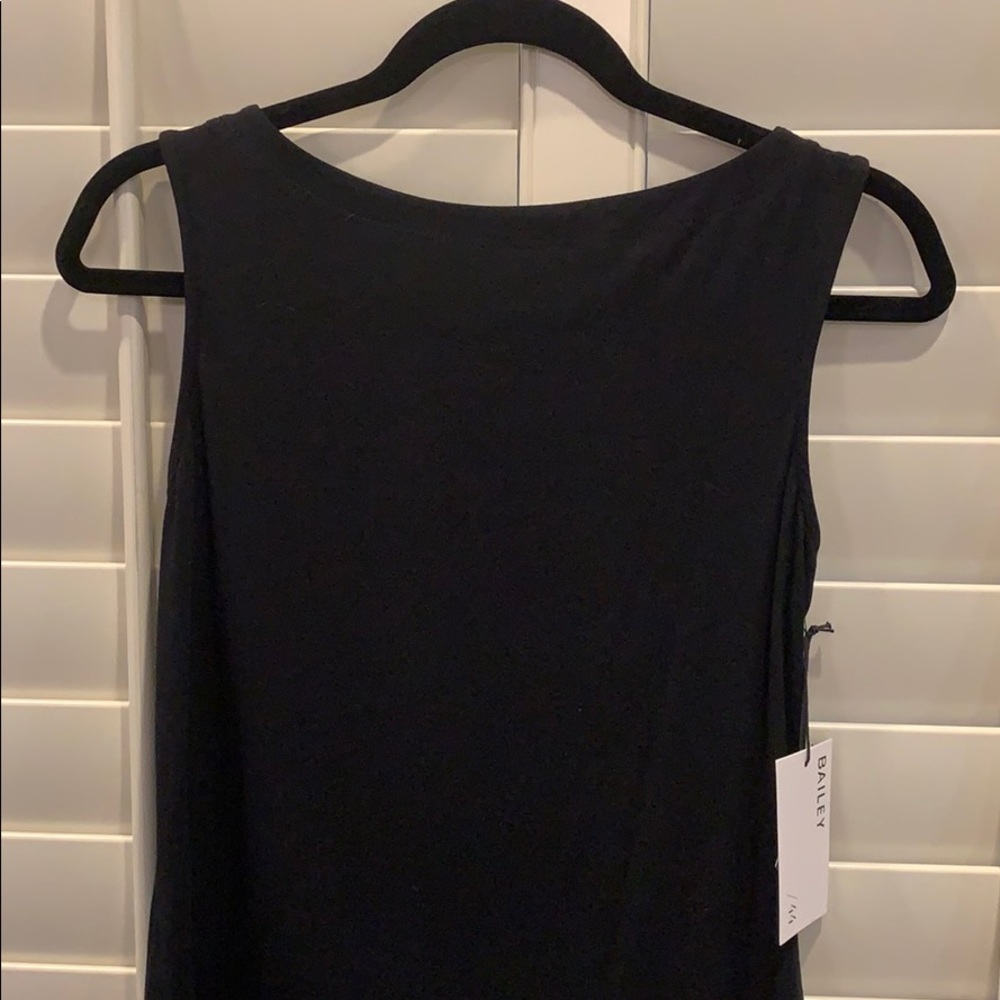 Black sleeveless top with lacing on one side